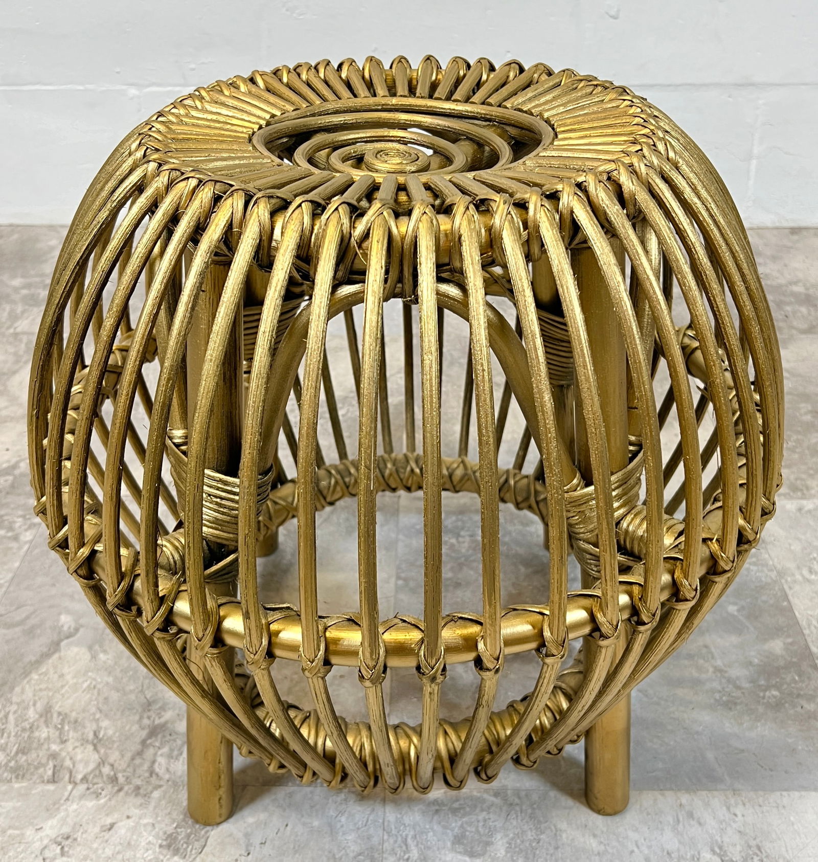 AFTER ALBINI OTTOMAN: AFTER FRANCO ALBINI GILT DECORATED RATTAN STOOL. 16"H