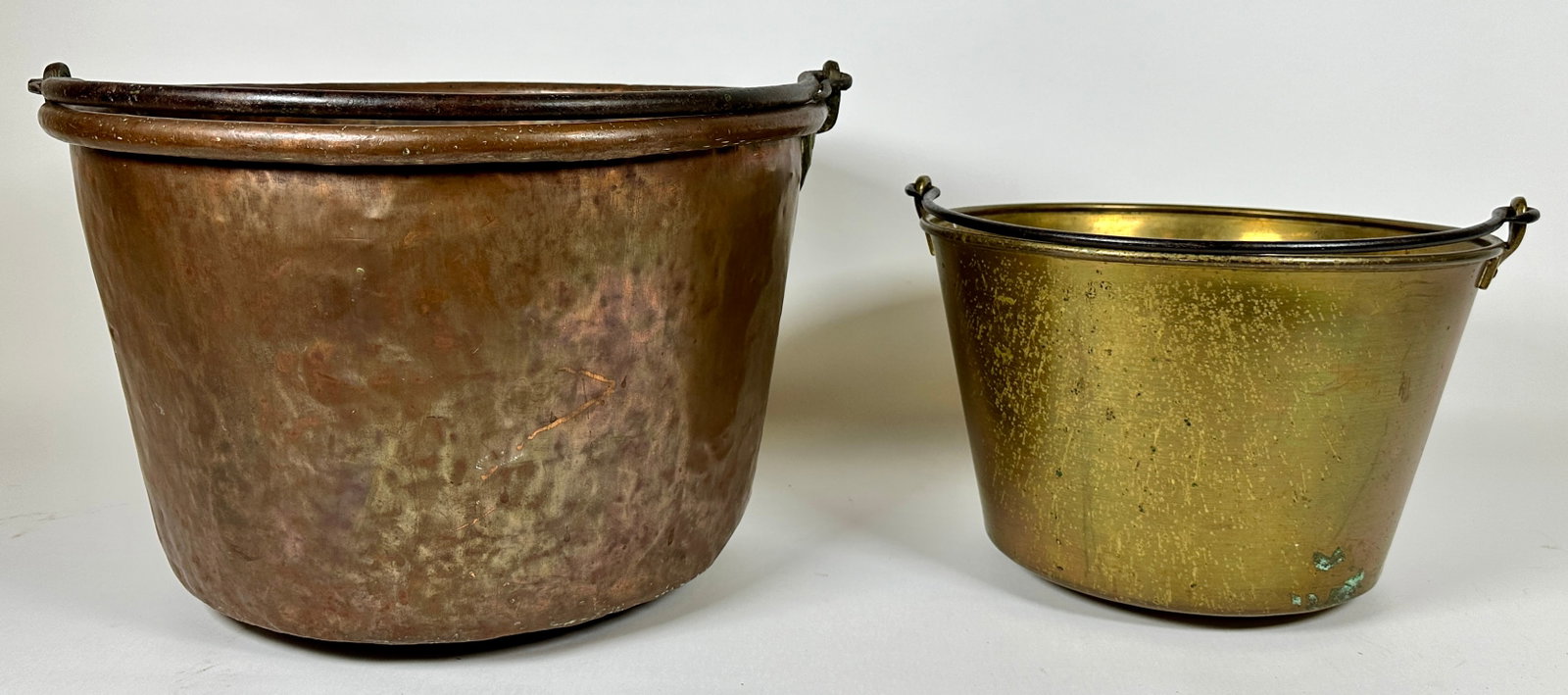 PAIR OF WITCH'S CAULDRONS: COPPER AND BRASS. LARGEST 18" DIA.