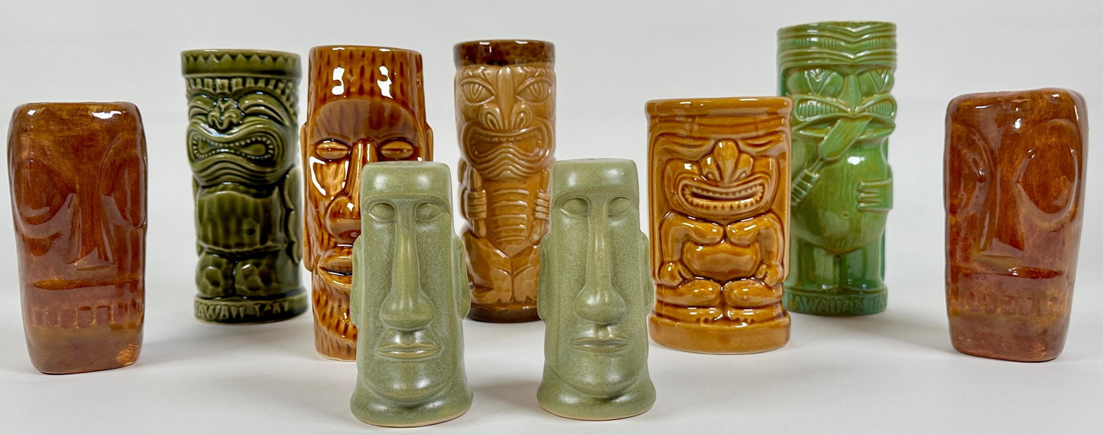 VINTAGE TIKI COLLECTION: TIKI MUGS AND SHAKERS INCLUDING KAHIKI SUPPER CLUB, ORCHIDS OF HAWAII AND OTHERS. TALLEST IS 7"