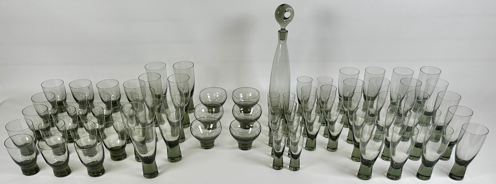 PER LUTKEN HOLMEGAARD DRINKWARE: PER LUTKEN HOLMEGAARD SMOKED GLASS DRINKWARE, A COUPLE WITH MINOR RIM CHIPS.