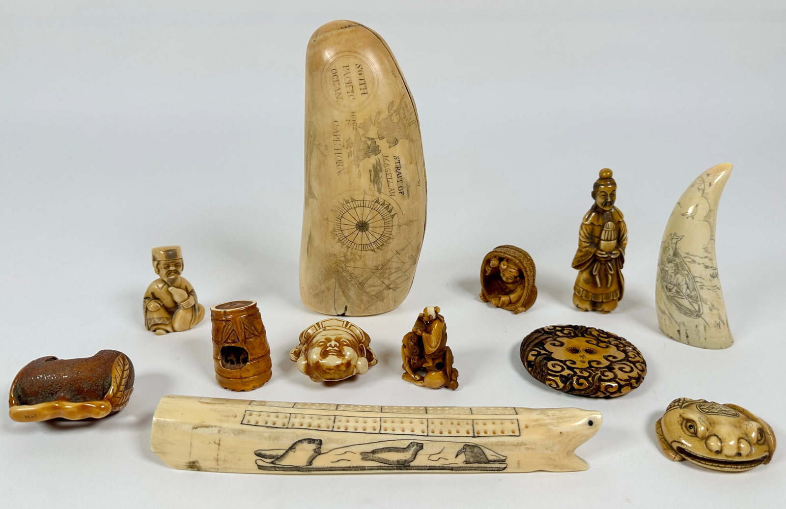 COLLECTION OF NATURAL CARVINGS: INCLUDES SCRIMSHAW CARVINGS, FIGURAL NETSUKE