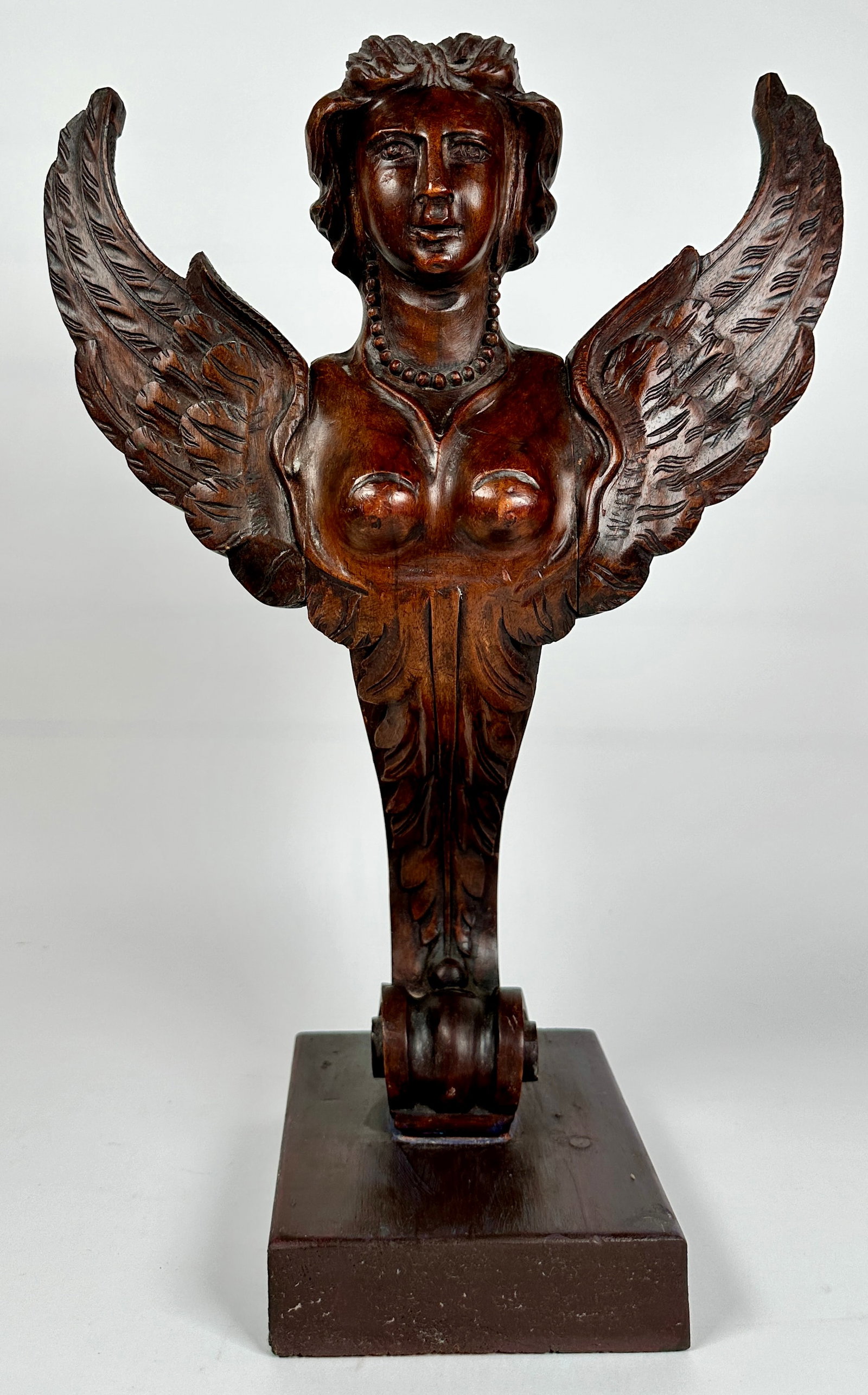 ARCHITECTURAL CARVED FRAGMENT: FIGURAL CARVING OF A WINGED GODDESS. 18"