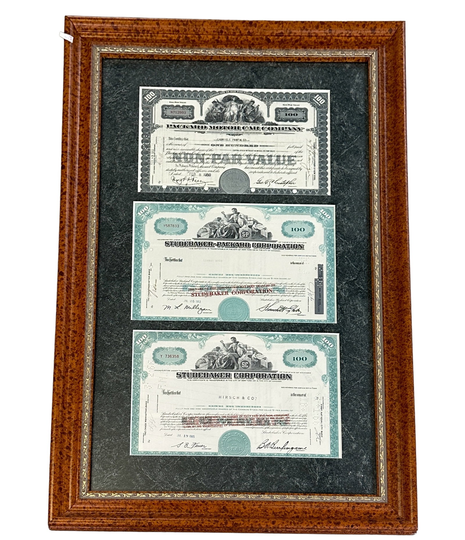 AUTOMOBILE COMPANY STOCK CERTIFICATES: 1950'S AND 60'S AUTOMOBILE COMPANIES. PACKARD, STUDEBAKER-PACKARD, STUDEBAKER. FRAMED, 20"X32"