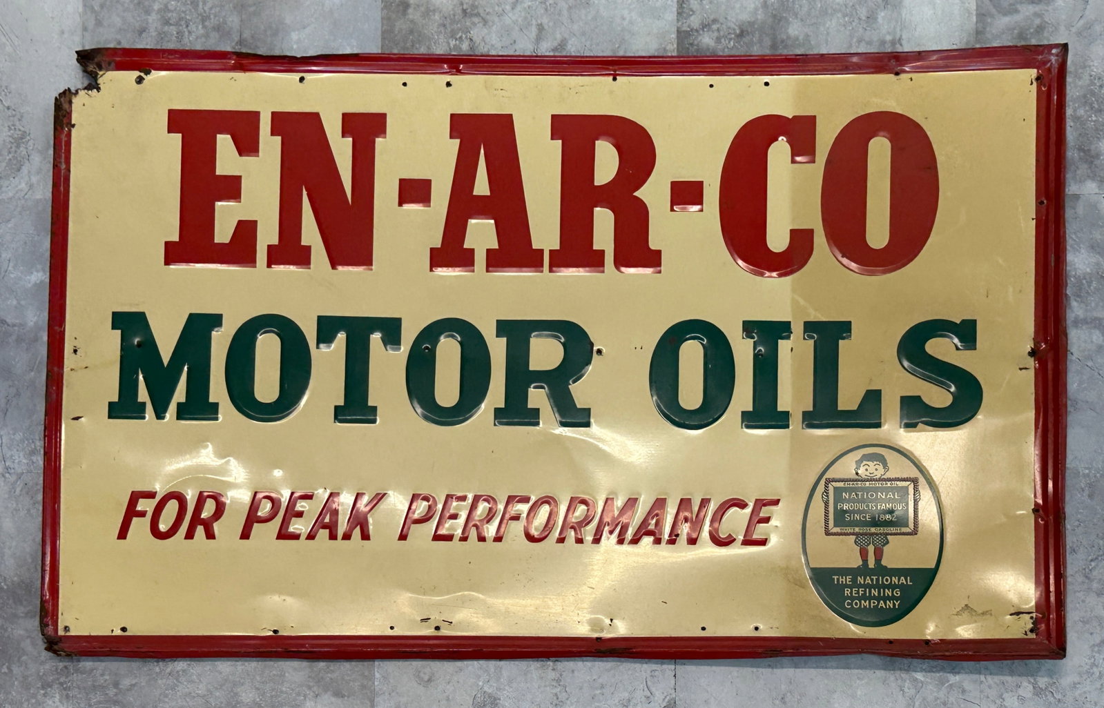EN-AR-CO MOTOR OILS SIGN: EN-AR-CO - NATIONAL PRODUCTS - WHITE ROSE GASOLINE - NATIONAL REFINING COMPANY. SINGLE SIDED, EMBOSSED, LOSSE AT UPPER LEFT CORNER, MOUNTING HOLES, RIGHT FIELD FADING. 26"X40"