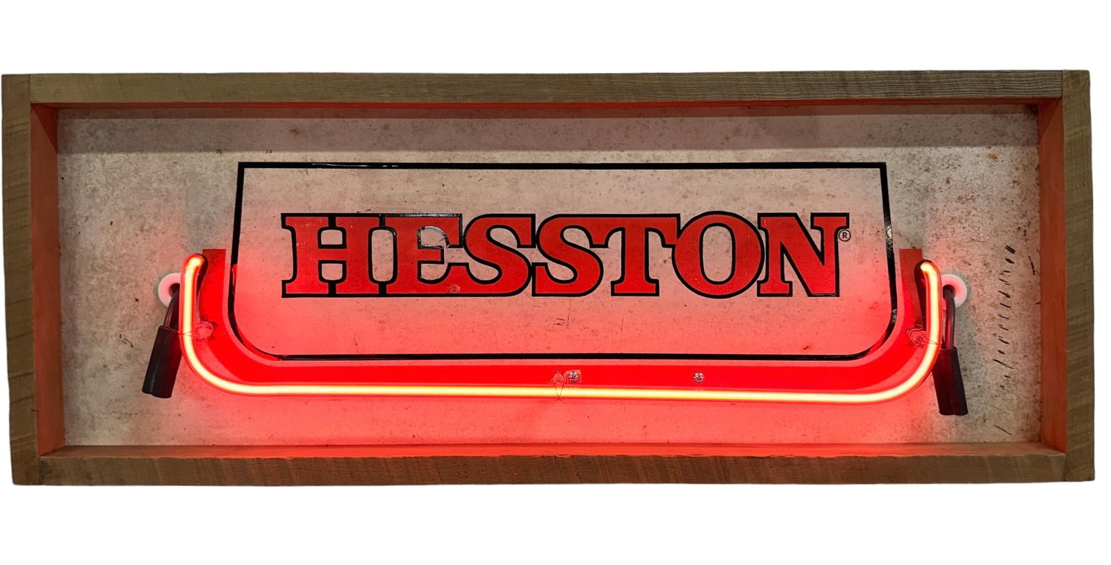 HESSTON TRACTOR NEON SIGN: IN WORKING ORDER, WOODEN FRAMEWORK AROUND METAL SIGN WITH NEON TUBE ACCENT. 34"X13"