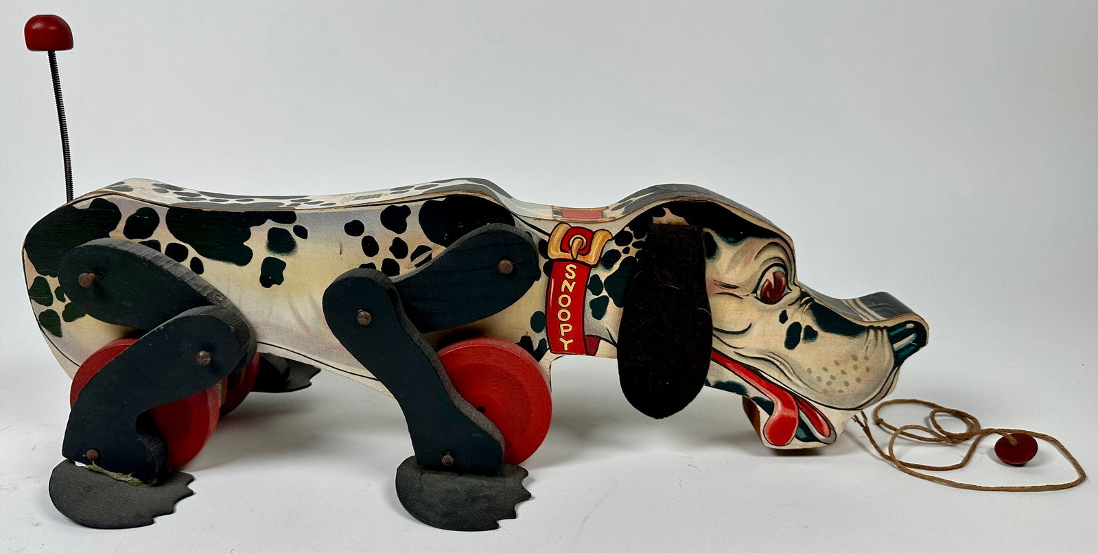 FISHER PRICE SNOOPY PULL TOY: PULL ACTIVATED NOISE, ORIGINAL STRING BEGINNING TO FRAY. 17"