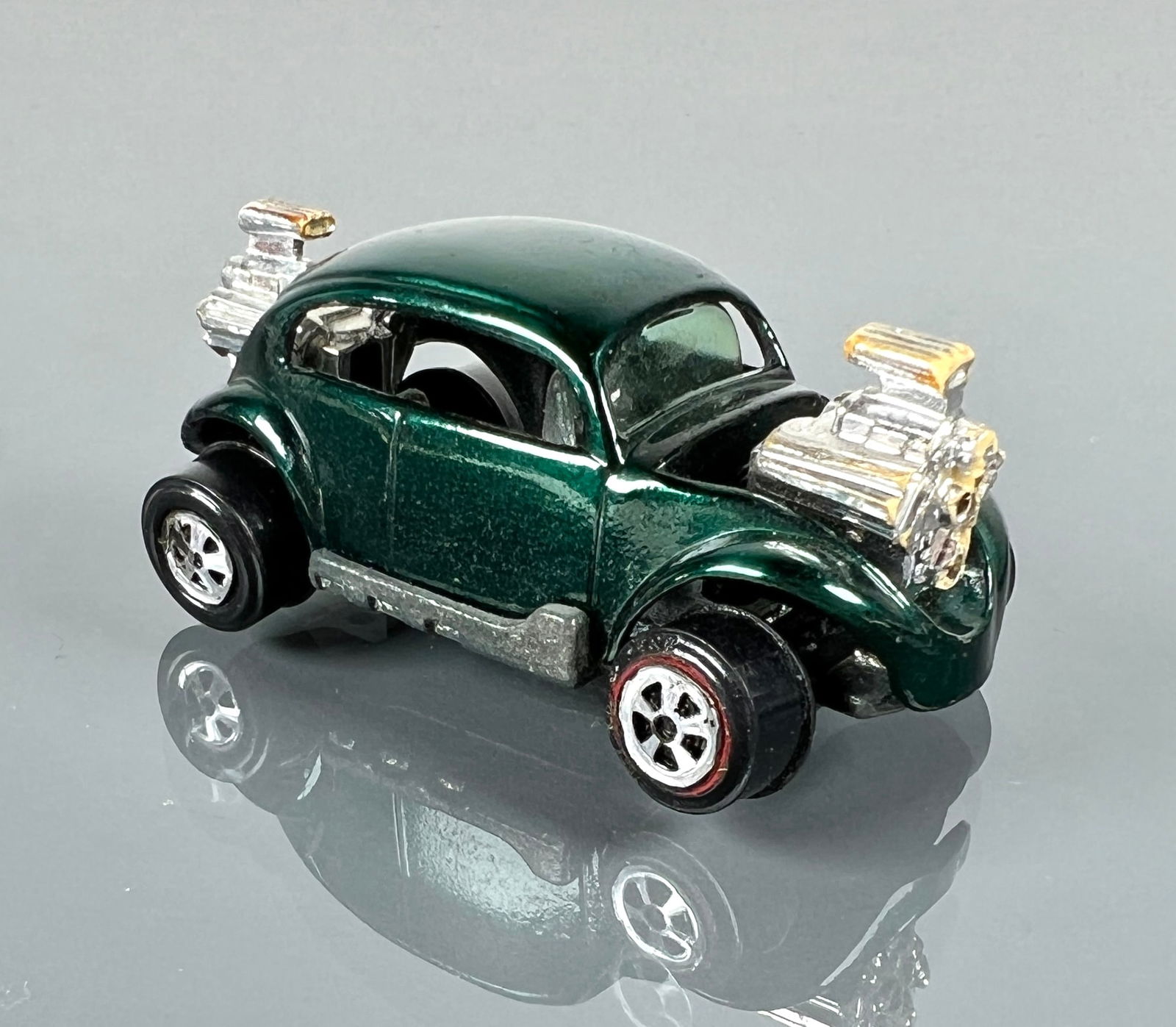 HOT WHEELS - Johnny Lightning Bug Bomb 1970: Green/Aqua rare color, body VG with a few micros, wheels 95% w/factory error smudge, no pipes