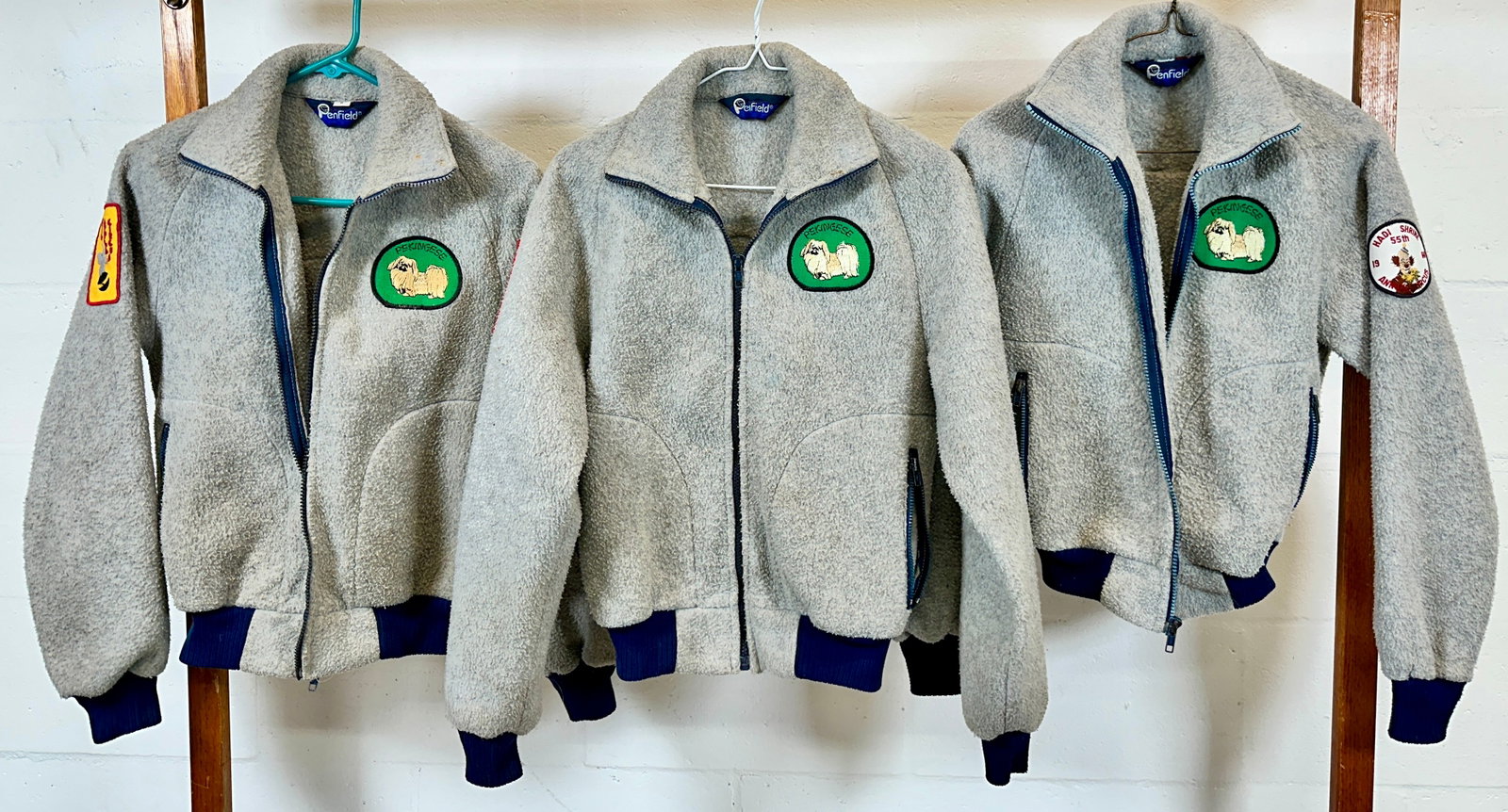 DAVID ROSAIRE'S PERKY PEKES JACKETS: DAVID ROSAIRE'S WORLD RENOWNED ACT, PERKY PEKES TOURED THE GLOBE FOR OVER 60 YEARS. GROUPING OF JACKETS WITH SEWN AND IRON ON PATCHES BEARING THE ACT NAME. SIZE SMALL.