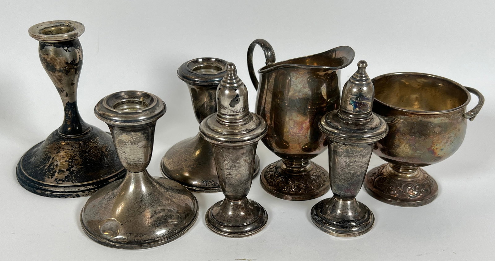STERLING SILVER TABLE ITEMS: INCLUDES WEIGHTED CANDLES, SUGAR AND CREAMER.