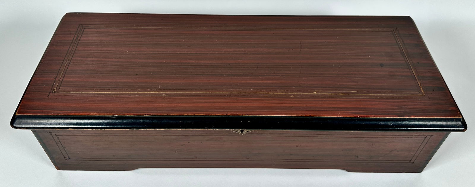 W. J. DYER & BRO. MUSIC BOX: ORIGINAL VINTAGE CONDITION, C.1890. EBONIZED ROSEWOOD CASE, PLAYS BEAUTIFULLY AS IT SHOULD. 23"X9.5"X6"