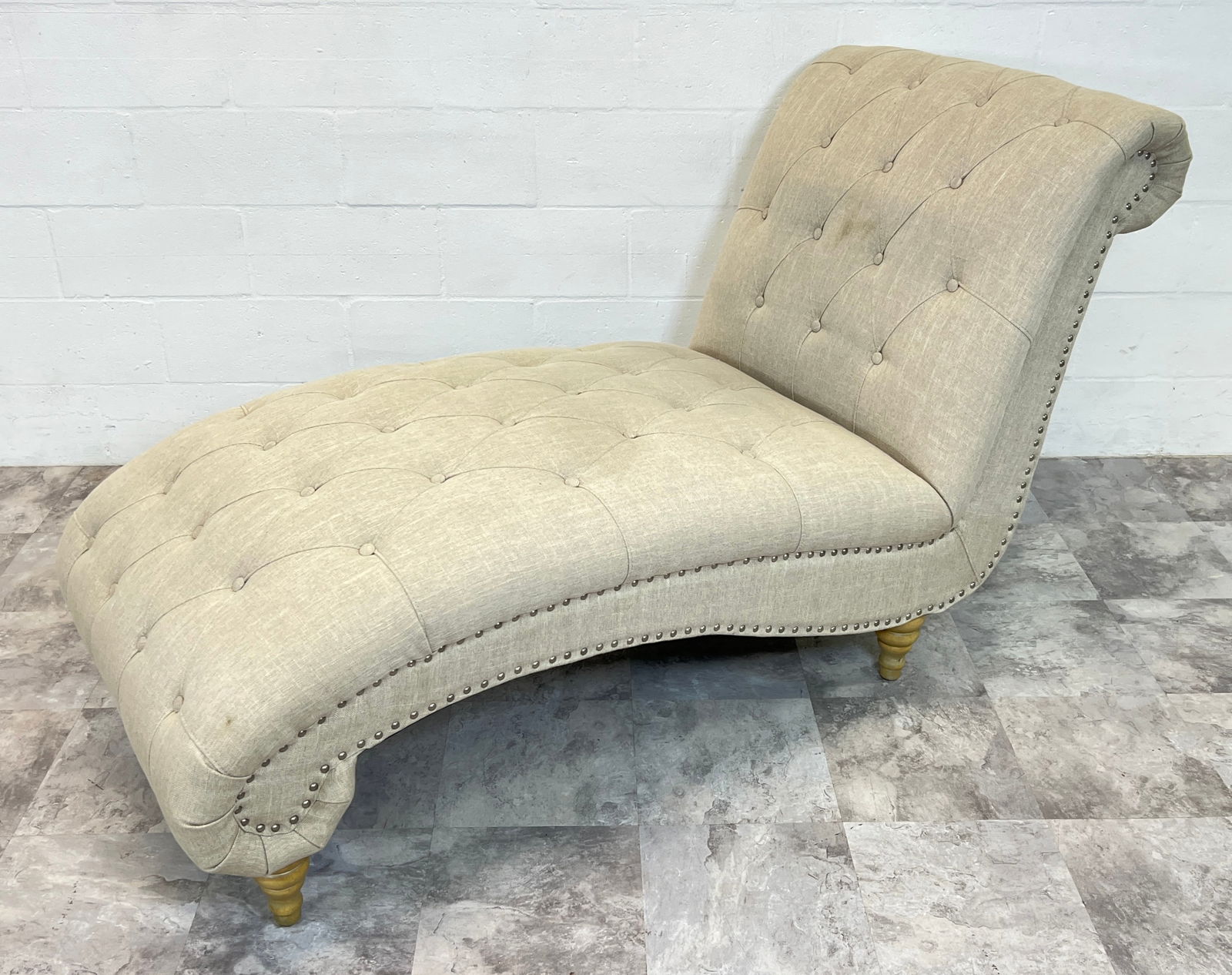 CONTEMPORARY CHAISE: METAL STUD ACCENTS TO SIDE, ROLLED DESIGNED, BUTTON TUFTED. 70"L, 30"W.