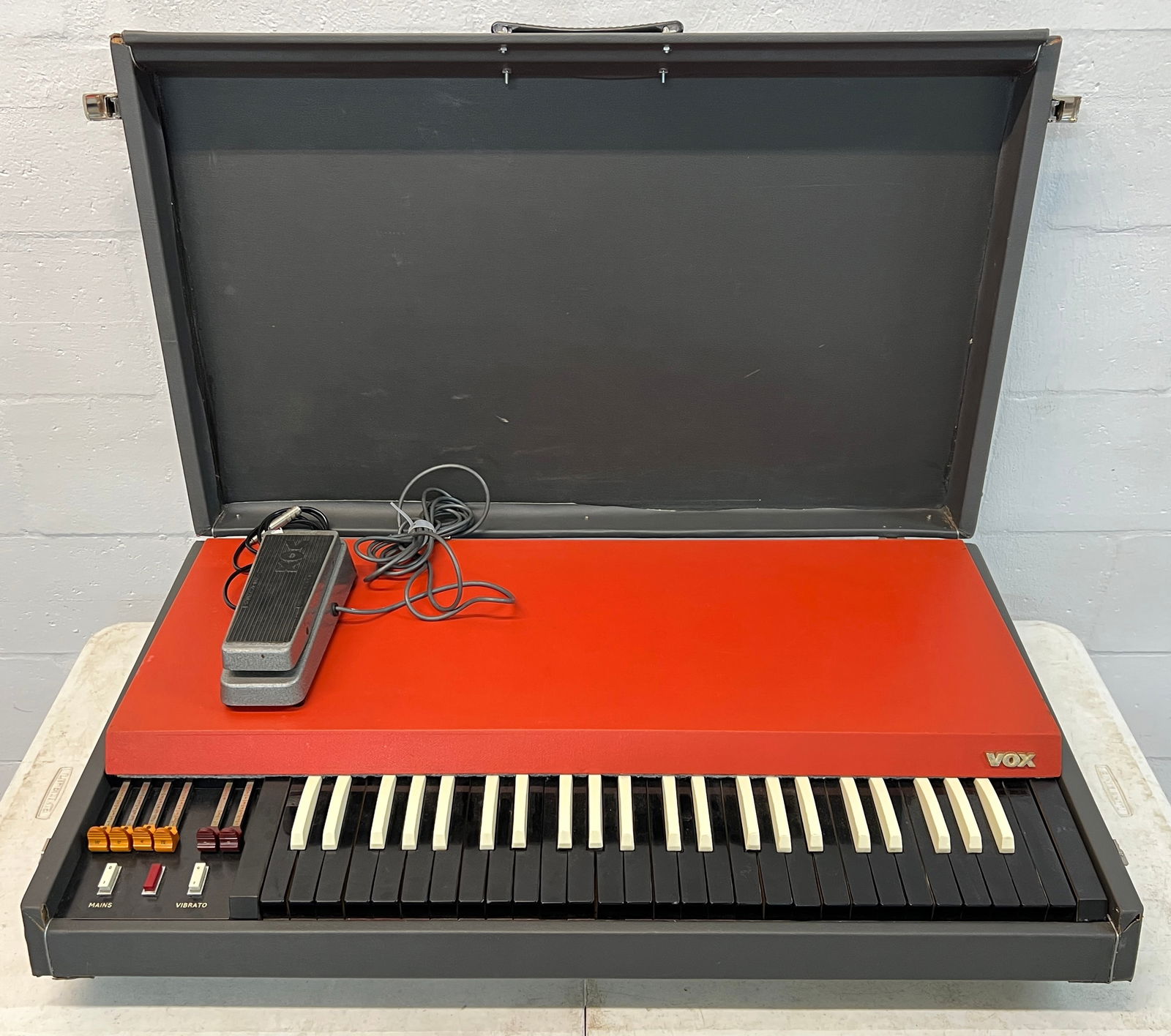 ORIGIANL VOX CONTINENTAL ORGAN: NO POWER CORD BUT HAS BEEN TESTED, IN WORKING ORDER. ORIGINAL VOX PEDAL. 36"X22"X8". 65 POUNDS