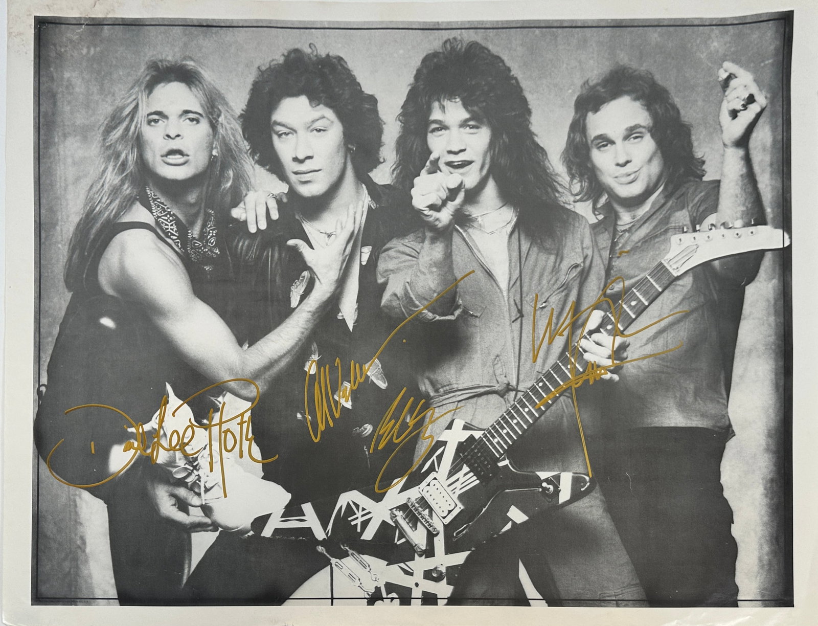VAN HALEN SIGNED POSTER: SIGNED BY DAVIS LEE ROTH, EDDIE VAN HALEN, ALEX VAN HALEN, MICHAEL ANTHONY. STAINING IN UPPER LEFT CORNER. 19" X 25". PERSONALLY RECEIVED.
