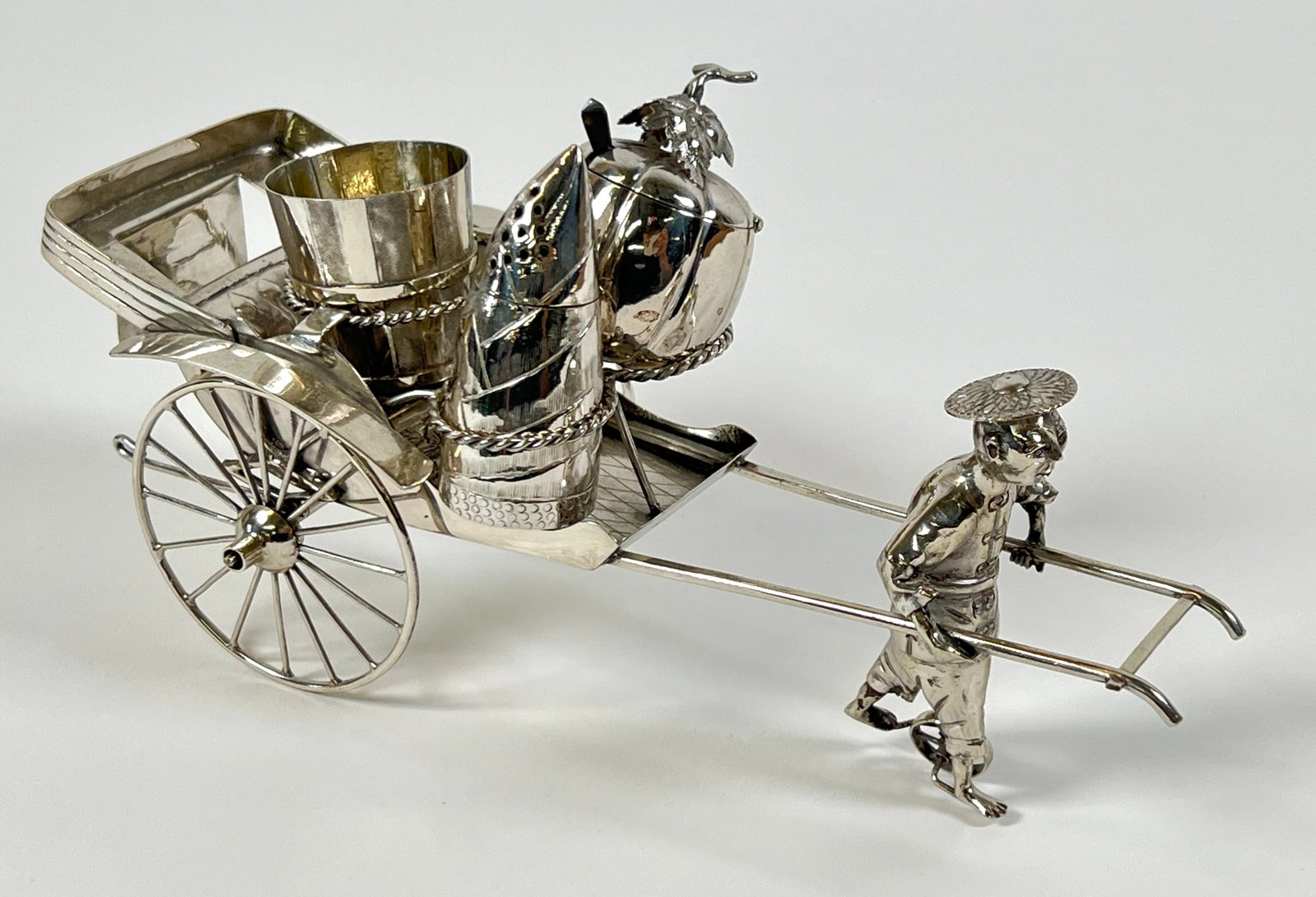 SILVER TABLE SERVICE CART: STERLING SILVER RICKSHAW CART WITH SERVING COMPARTMENTS. 236 GRAMS TOTAL WEIGHT. 8"L