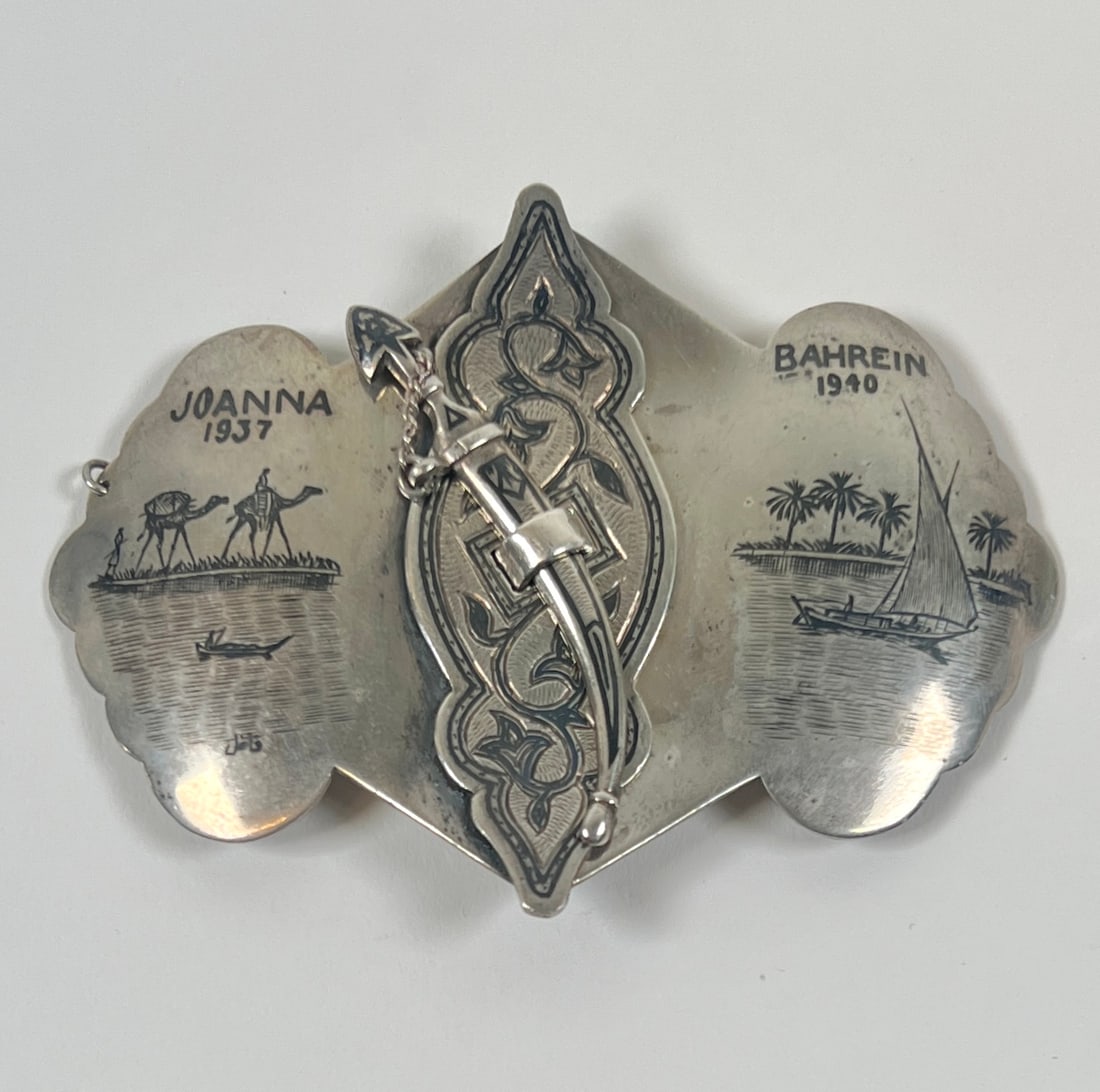 VINTAGE SILVER AND MIELLO BELT BUCKLE: JOANNA - 1937, BAHREIN - 1940. 54 GRAMS TOTAL WEIGHT. 3.5"X2.25"