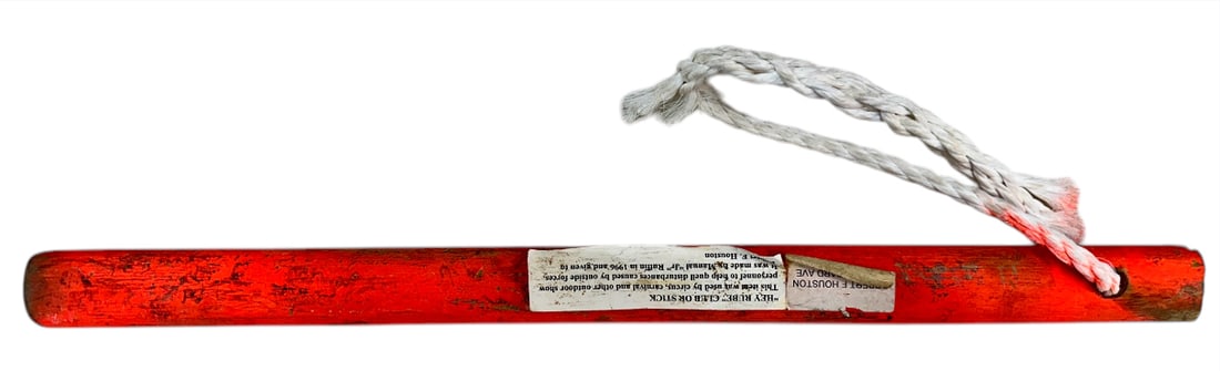 HEY RUBE RIOT STICK: HEY RUBE CLUB OR STICK MADE BY MANUAL JUNIOR RUFFIN - PRINCE BOGINO. HEY RUBE WAS A PHRASE USED TO NOTIFY CIRCUS WORKERS OF A DISTURBANCE IN THE TENT. SUBJECT CLUB IN HIGHLY VISIBLE NEON ORANGE PAINT 