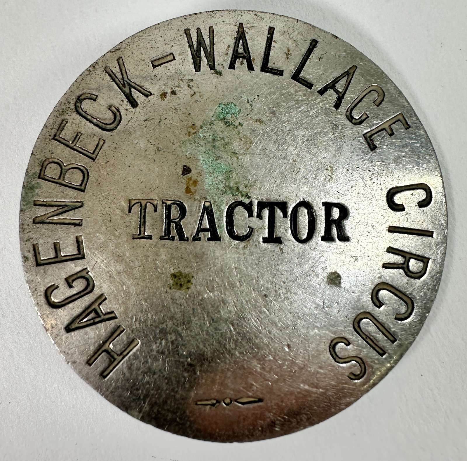 HAGENBECK-WALLACE EMPLOYEE BADGE: SCARCE. TRACTOR EMPLOYEE BADGE. PIN-BACK. 1.75"
