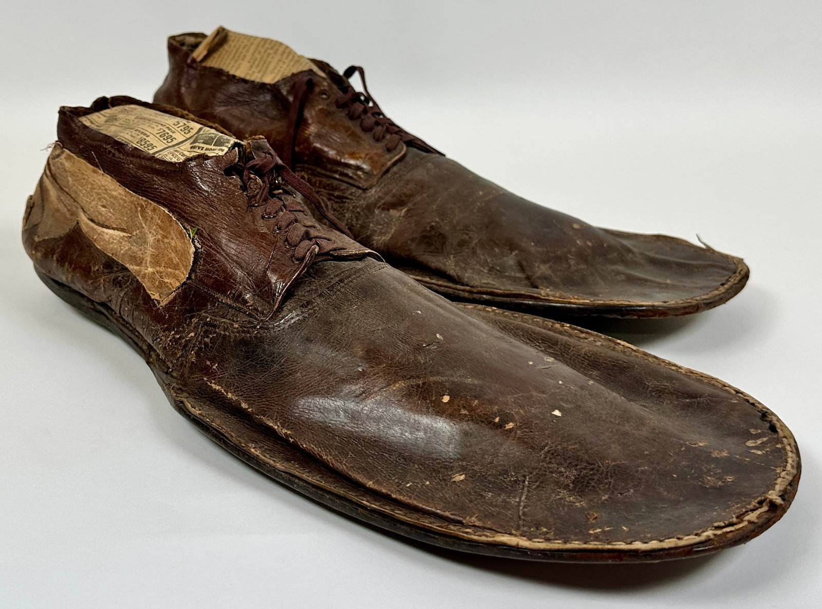 OTTO GRIEBLING CIRCUS TRAMP CLOWN SHOES: ORIGINAL SHOES AS WORN BY TRAMP CLOWN OTTO GRIEBLING. ROBERT F. HOUSTON COLLECTION. OTTO GRIEBLING (AMERICAN, 1896-1972) SPENT HIS EARLY YEARS WITH A TROUPE OF BAREBACK RIDERS AND WHEN AN ACCIDENT FOR