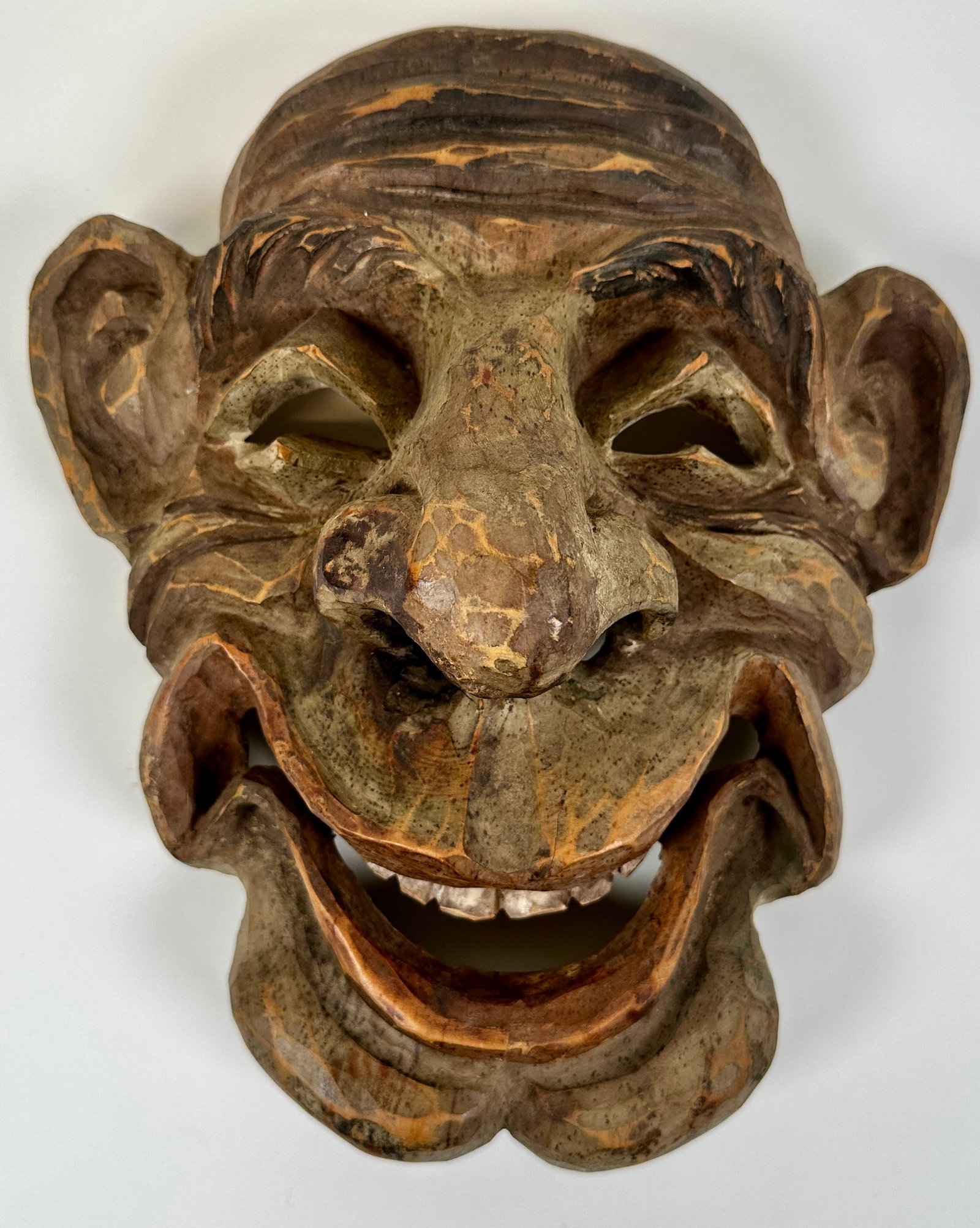 HAND-CARVED FACE: PORTRAITURE OF A MAN'S FACE, HAND-CARVED AND DECORATED. ROBERT F. HOUSTON COLLECTION. 11"X10"