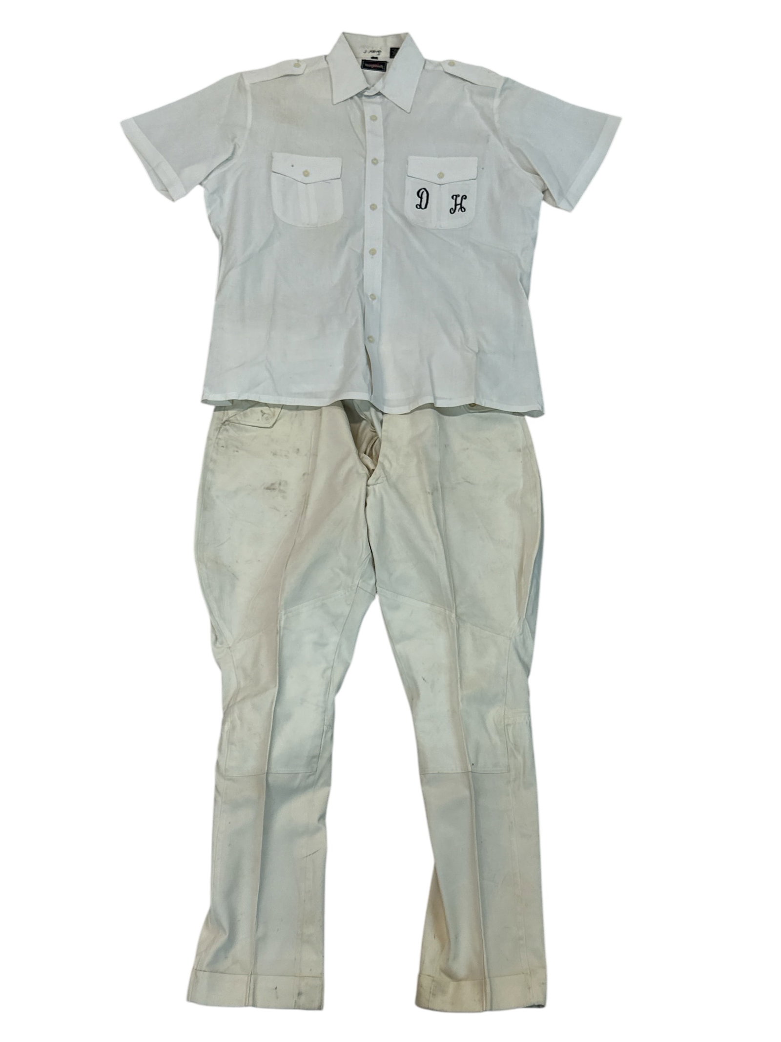DAVE HOOVER WILD ANIMALS WARDROBE: WHITE PANTS AND SHIRT AS WORN BY DAVE HOOVER DURING PRESENTATION OF HIS LION AND TIGER ACT. DAVE HOOVER (AMERICAN, 1930-2006) WAS A WILD ANIMAL TRAINER AND PROT?G? OF CLYDE BEATTY. HOOVER PERFORMED WI