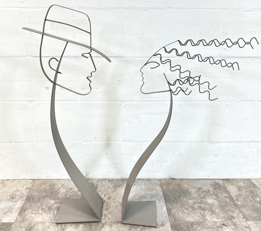 FIGURAL MAN WOMAN DECORATIVE BUSTS: SILVER METAL SCULPTURES OF A MAN AND WOMAN, 32"