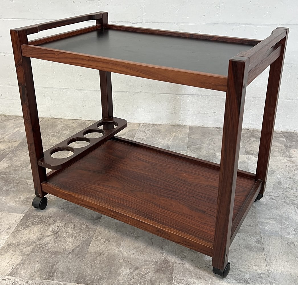 DANISH MODERN ROSEWOOD BAR CART: EBONIZED UPPER PLATFORM, LOWER BOTTLE HOLDER. TOP WITH SURFACE WEAR. 31"X19"X28"