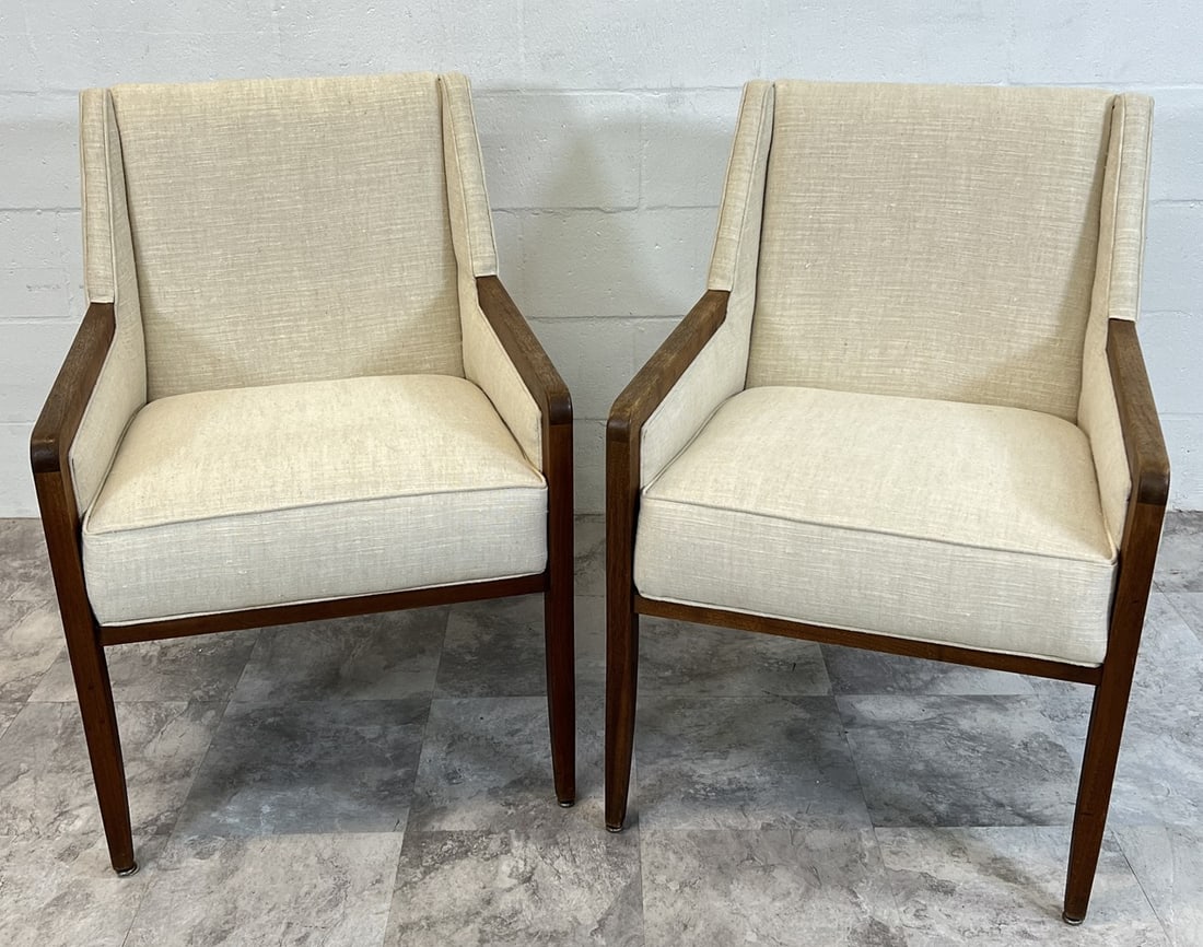 MID-CENTURY LOUNGE CHAIRS: PAIR OF CREAM UPHOLSTERED LOUNGE CHAIRS WITH WALNUT STRUCTURE. UNMARKED