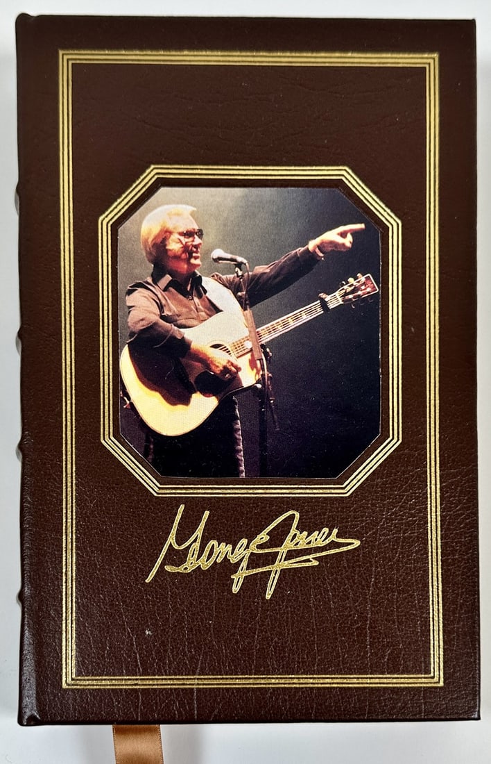 I LIVED TO TELL IT ALL - GEORGE JONES: EASTON PRESS, LEATHER BOUND FIRST EDITION IS SIGNED BY GEORGE JONES. INCLUDES CERTIFICATE OF AUTHENTICITY. GEORGE JONES WITH TOM CARTER, 1996. EXCELLENT