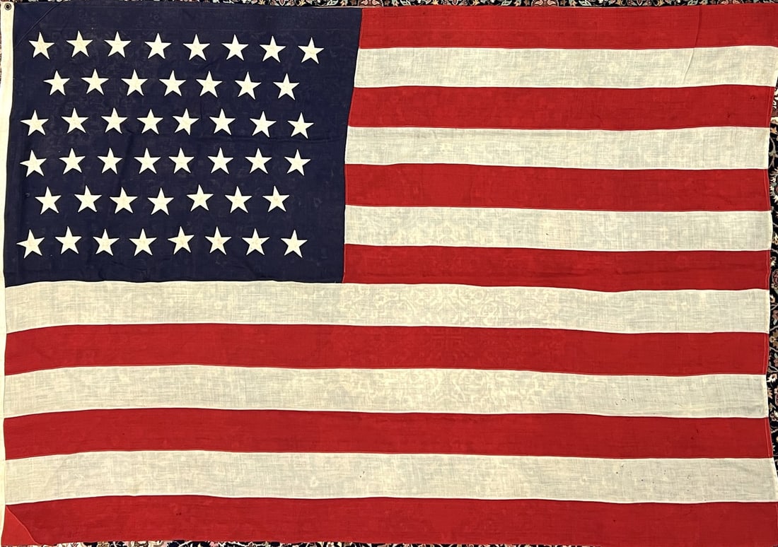 VINTAGE UNITED STATES 46 STAR FLAG: IN USE FROM 1908-1912. SCATTERED MINOR WEAR CONSISTENT WITH USE. 59"X87"