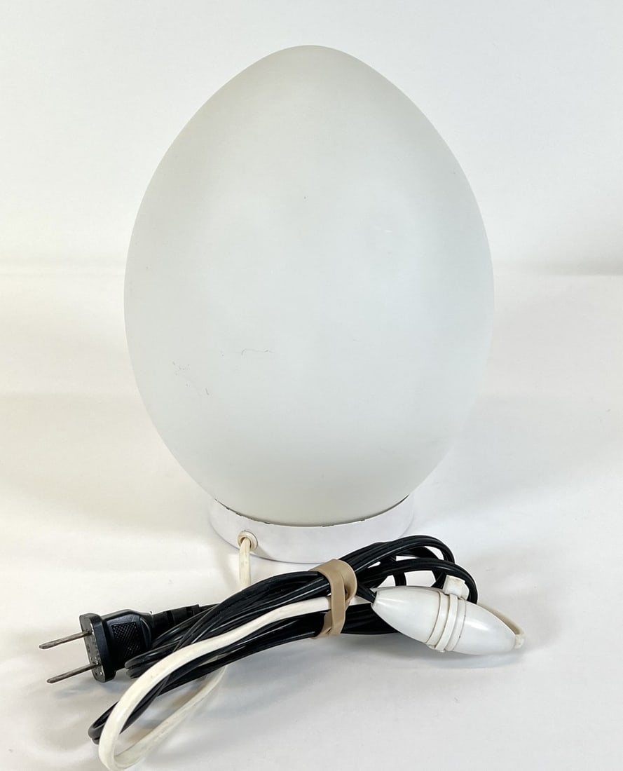 MANNER OF LIGHTOLIER EGG LAMP: GLASS EGG ATOP METAL BASE, UNSIGNED. 9"H