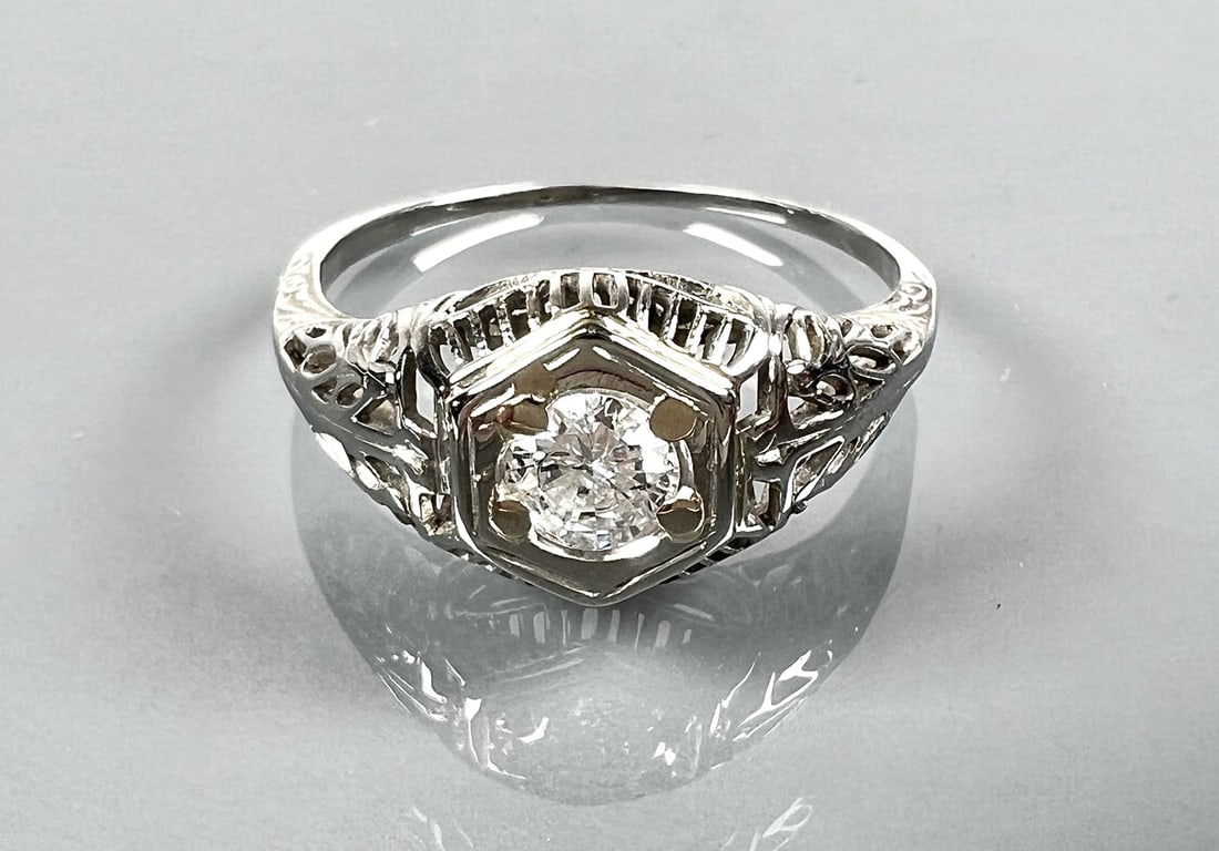 14K WHITE GOLD DIAMOND SOLITAIRE FILIGREE RING: ONE BRILLIANT CUT DIAMOND .37 CT RATED SI1 IN CLARITY AND H IN COLOR. 2.1 GRAMS TOTAL WEIGHT, SIZE 7.5. $1,700 GIA APPRAISAL INCLUDED