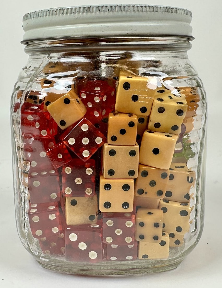 COLLECTION OF VINTAGE DICE - BAKELITE: INCLUDING SOME BAKELITE DICE. 160+ pieces, range in size from .375" to .6875". Vintage c.1940.