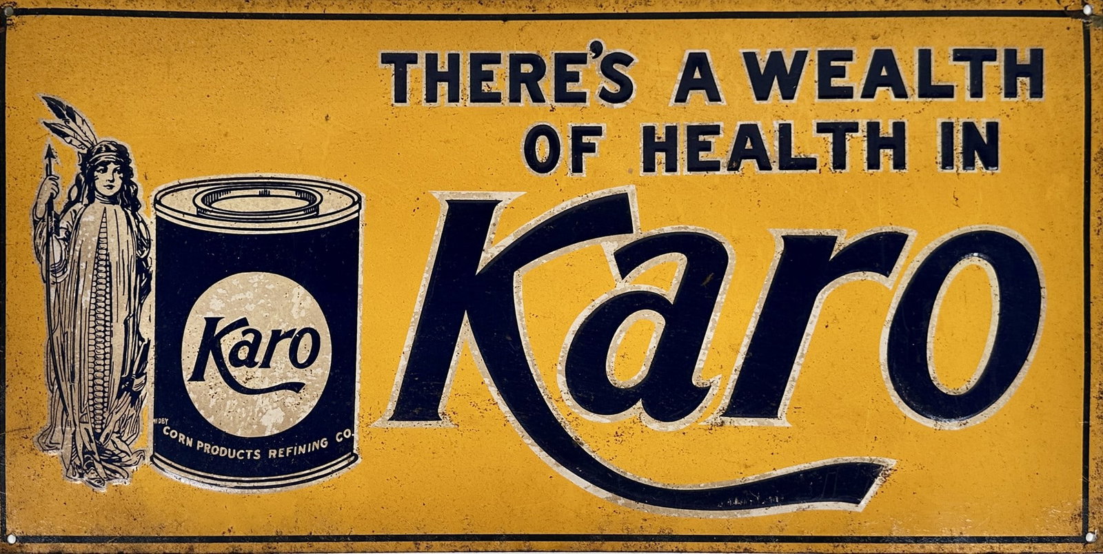 KARO ADVERTISING SST ADVERTISING SIGN: THERE'S A WEALTH OF HEALTH IN KARO. SINGLE SIDED TIN EMBOSSED SIGN. LIGHT PITTING, ELSE GOOD. 9"X18"