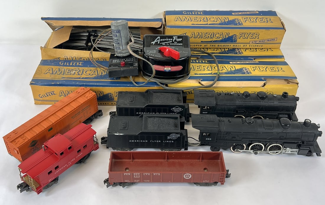 AMERICAN FLYER GILBERT TOY MODEL TRAIN SET: TWO ENGINES WITH TENDERS, STOCK CAR, HOPPER, CONTROLLER AND TRACK. TRACK BOXES WITH WEAR.
