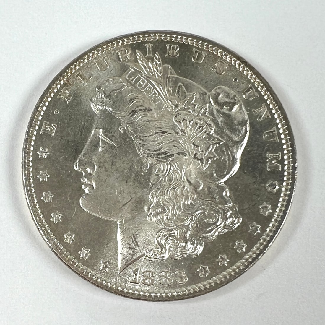 1883 MORGAN SILVER DOLLAR BU (1 of 2)
