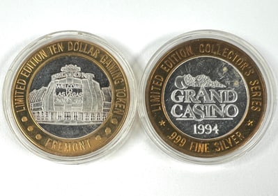 PAIR OF SILVER STRIKER CASINO TOKENS