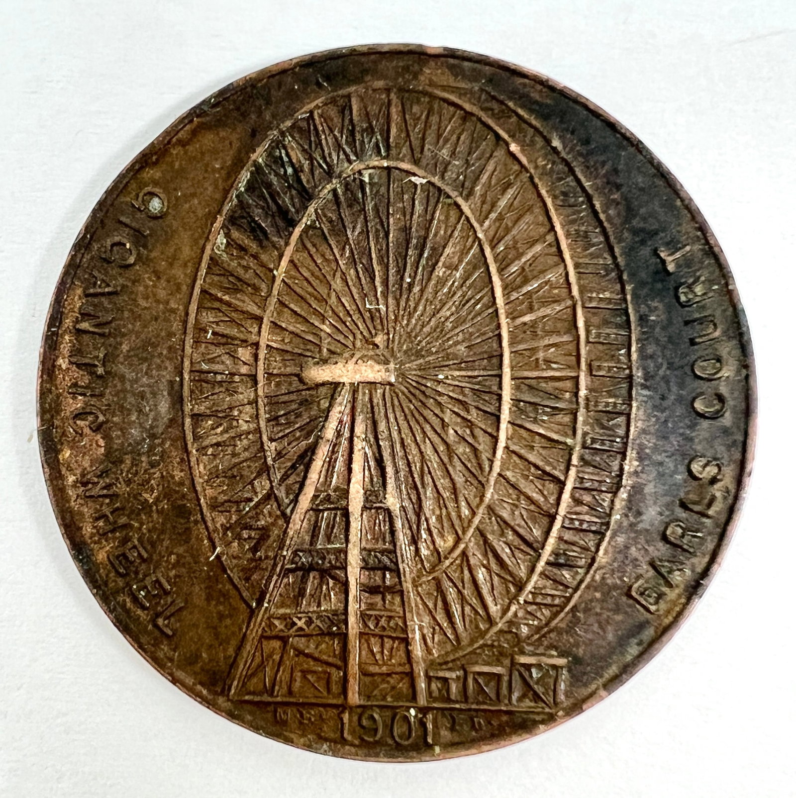 1901 Earl's Court Ferris Wheel Token Medal: Obverse: Gigantic Wheel - Earl's Court. Reverse: The Gigantic Wheel at Earl's Court is 284 feet in diameter and weighs about 900 tons. There are 40 cars, each to carry 30 person from the top of the wh