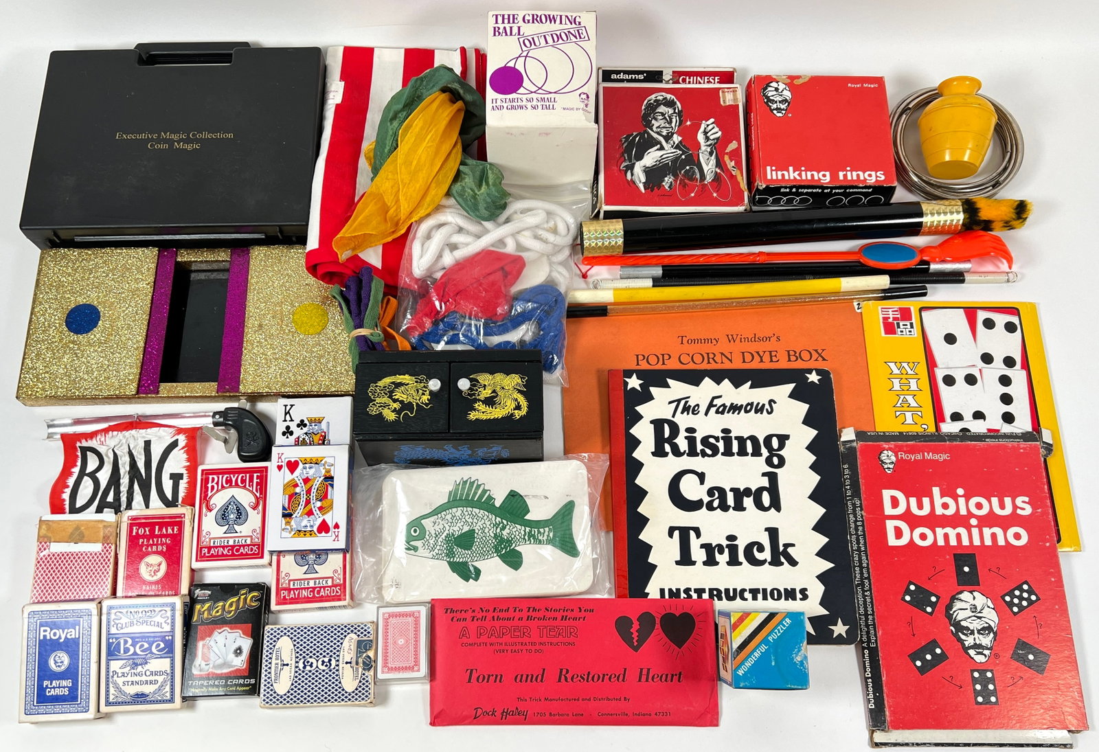 Collection of Contemporary Magic Tricks and Gimmicks: Multiple decks, wands, Die Box, Bang pistol, Linking Rings, coin magic and more. This item requires third party shipping.