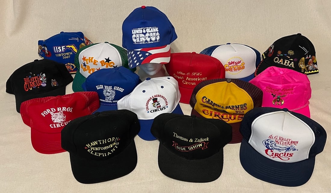 CIRCUS BALL CAPS: A COLLECTION OF FIFTEEN DIFFERENT: Circa 1970’s - 90’s. A nice assortment of both screen-printed and thread-embroidered ball caps, each different and unique, bearing various show titles and logos. Some never worn, others us