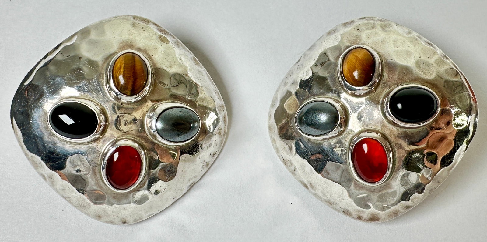 STERLING SILVER EARRINGS - MEXICO: HAMMERED STERLING SILVER WITH INSET STONES. 28 GRAMS TOTAL WEIGHT. 1,25"