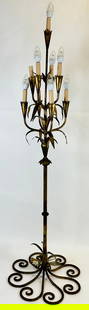 HANS KOGL (ATTR.) HOLLYWOOD REGENCY LAMP: GILT NINE-LIGHT FLOOR STANDING CANDELABRA LAMP. SOME OF THE CANDLE STICK SHROUDS ARE BRITTLE. 61"H. REQUIRES THIRD PARTY SHIPPING/TRANSPORATION.
