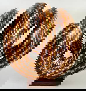 PAUL BARTLETT SEGMENTED WOOD ART SCULPTURE: PAUL BARTLETT (AMERICAN, CONTEMPORARY) SEGMENTED TURNED WOOD ART SCULPTURE TITLED: TWISTED PANTAGON. MOUNTED ON BASE. 17"X16"X16". REQUIRES THIRD PARTY SHIPPING/TRANSPORTATION.