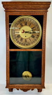 SESSIONS REGULAR WALL CLOCK: SESSIONS MOVEMENTS, OAK CASE CLOCK WITH CARVED DESIGNS. KEY. TESTED AND WORKING AT TIME OF SALE. SOLD AS IS. 17"X38"X4". REQUIRES THIRD PARTY SHIPPING/TRANSPORATION.