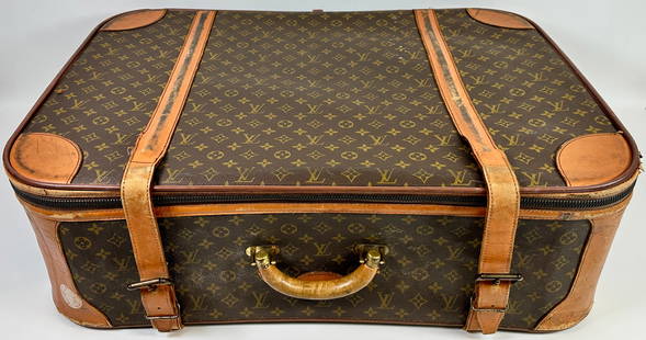 VINTAGE LOUIS VUITTON MONOGRAM SUITCASE: ROAD-WORN LV MONOGRAM SUITCASE, WEAR AT LEATHER CORNERS, STRAPS AND PIPING. SOLD AS-IS. 20"X30"X9". REQUIRES THIRD PARTY SHIPPING/TRANSPORTATION.