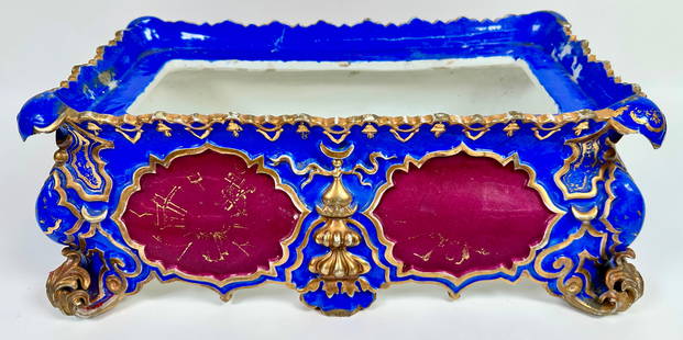 OLD PARIS JACOB PETIE (ATTR.) PLANTER: PORCELAIN POLYCHROME DECORATED PLANTER OR FERNER. NO INSERT. LOSS OF SOME DECORATION, MINOR SCATTERED CHIPS AT CORNERS. 6"X17"X10". REQUIRES THIRD PARTY SHIPPING/TRANPORTATION.