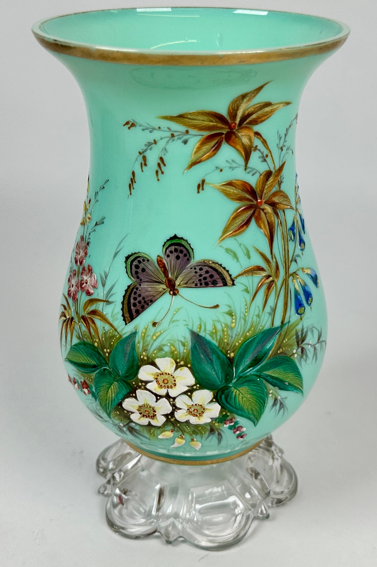 VINTAGE HAND-PAINTED ART GLASS VASE: CASED GLASS VASE WITH HAND-PAINTED GARDEN SCENE WITH BUTTERFLY AMONG FLOWERS. UNSIGNED. 8"H