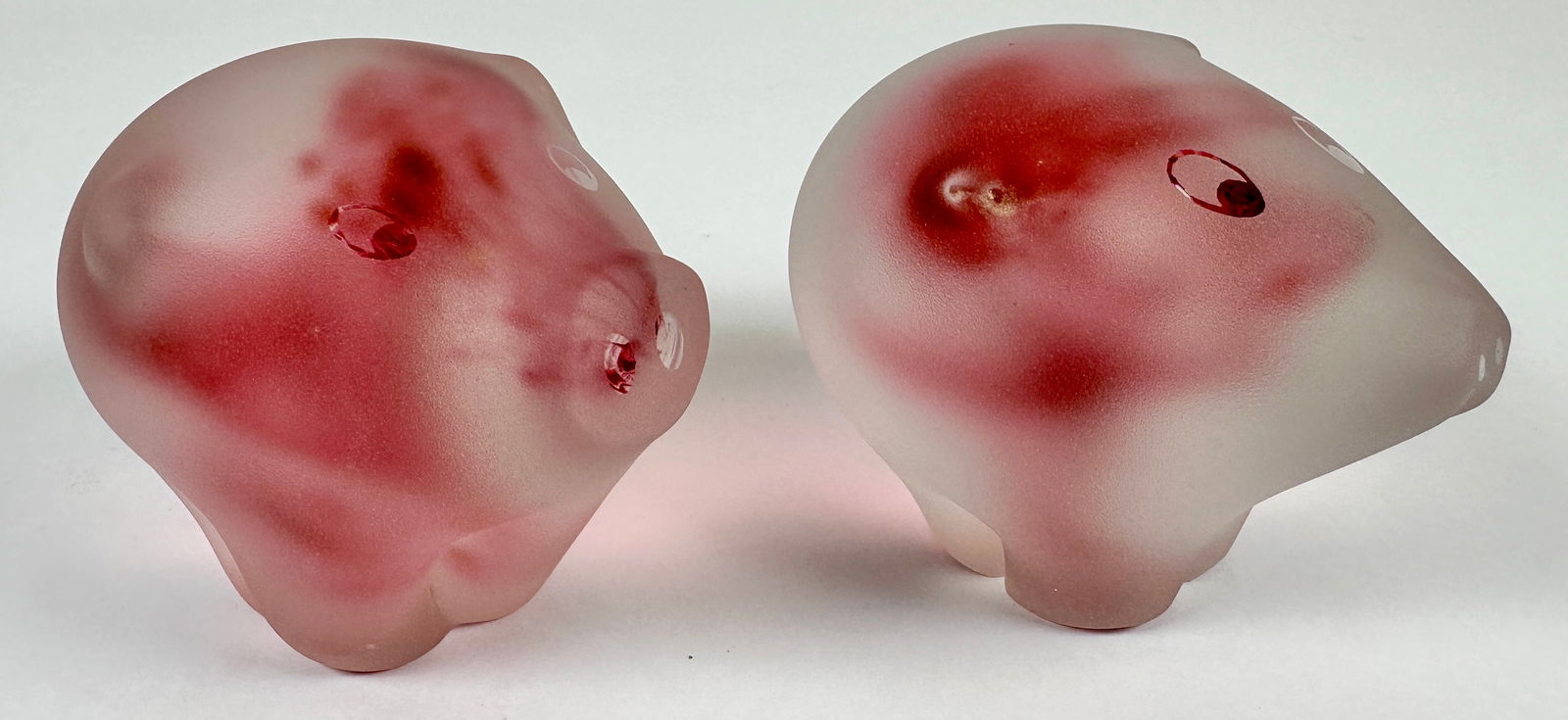 PAIR OF ART GLASS PIG PAPERWEIGHTS: UNSIGNED, PINK TRANSLUCENT/FROSTED PIG ART GLASS PAPERWEIGHTS. 3.5"H
