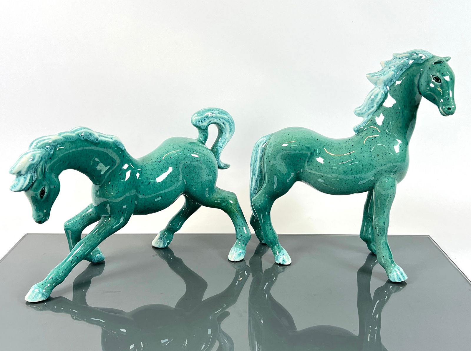 FRANK ENGLE STUDIO FIGURAL HORSES: PAIR OF CERAMIC HORSES, FRANK ENGLE STUDIO. MARKED. TALLEST 12"H. REQUIRES THIRD PARTY SHIPPING.