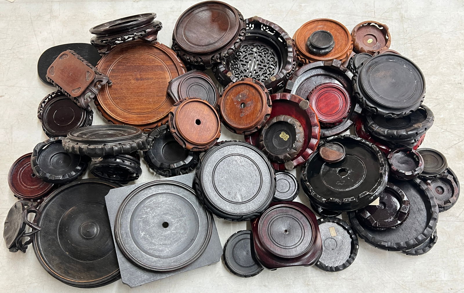 COLLECTION OF CHINESE STANDS: COLLECTION OF HARDWOOD AND OTHER DISPLAY STANDS. LARGEST 9", SMALLEST 3".