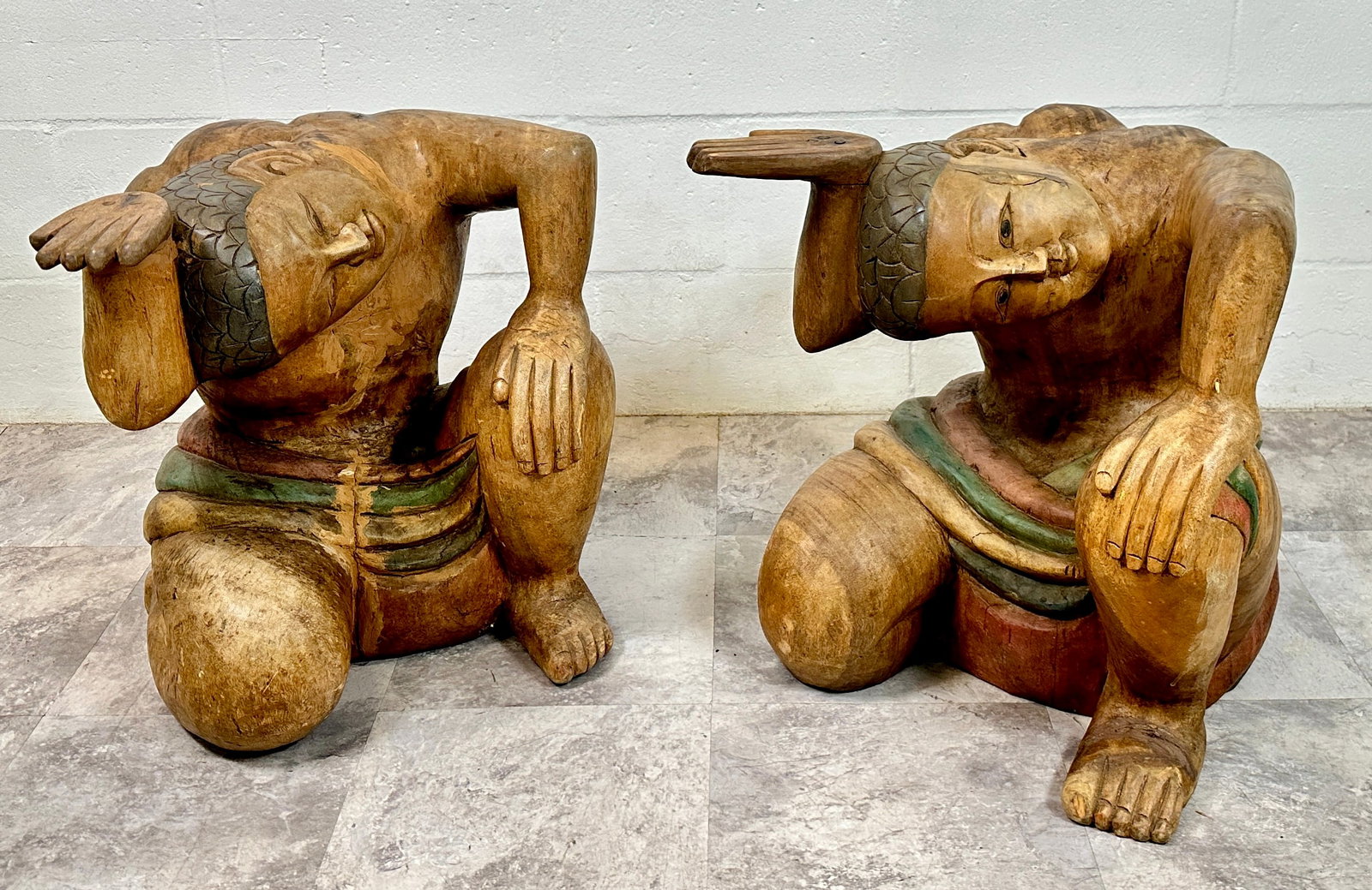 POLYCHROME TABLE BASE: PAIR OF WOOD-CARVED, POLYCHROME TABLE BASES IN THE FORM OF A MAN SUPPORTING THE UNDERSIDE OF THE TOP. GLASS TOPS NOT INCLUDED. 21"X21"X19". REQUIRES THIRD PARTY SHIPPING